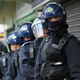 Metropolitan Police officers preparing a raid in London in 2011.